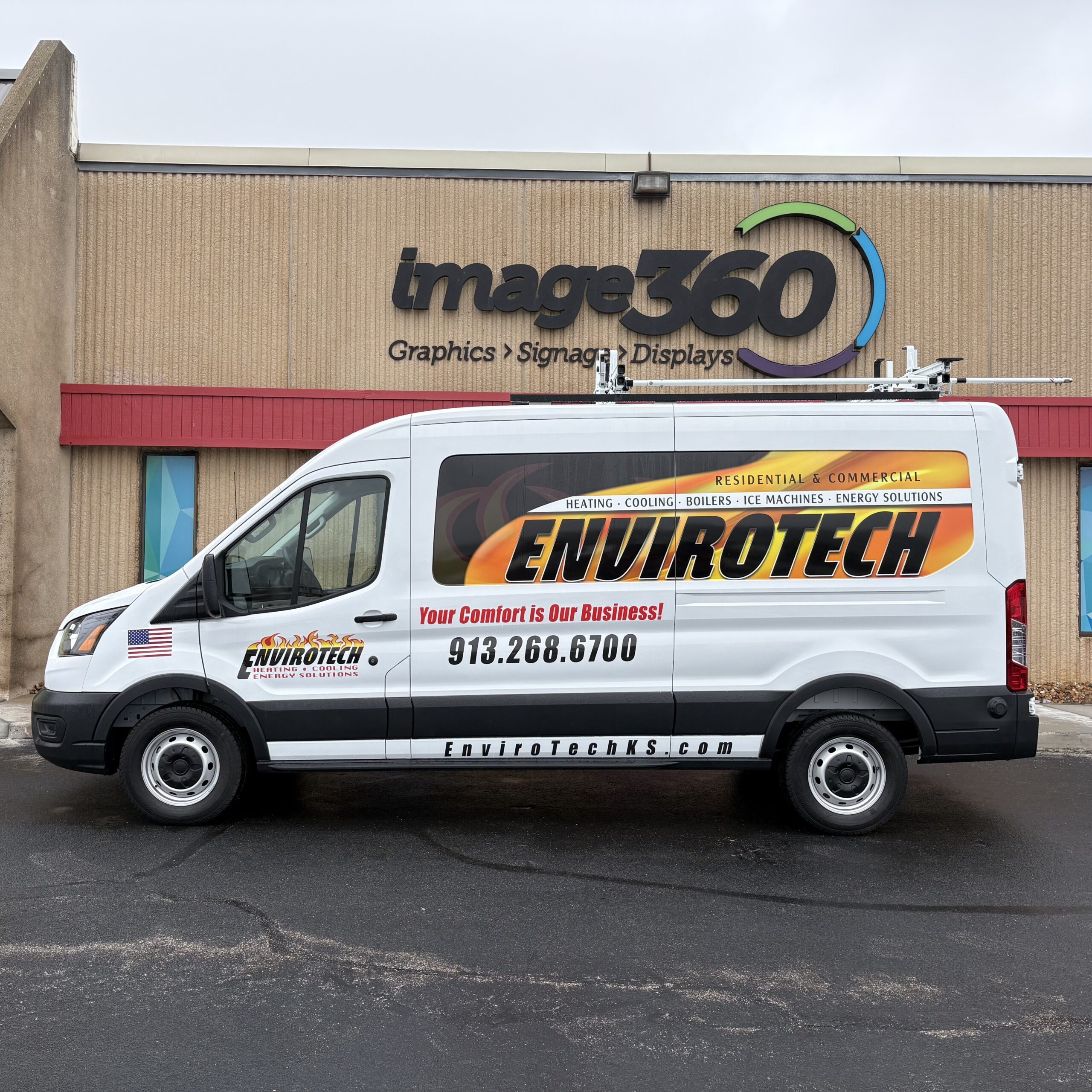 Orange and white vehicle graphics on an EnviroTech HVAC service van in Kansas City